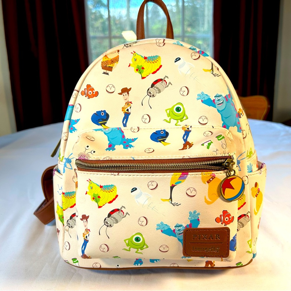 Loungefly Disney Pixar character Mini book bag, like new condition, tan